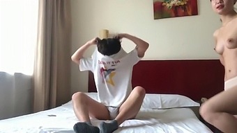 A Pair From China Engage In Intimacy Inside A Rented Apartment