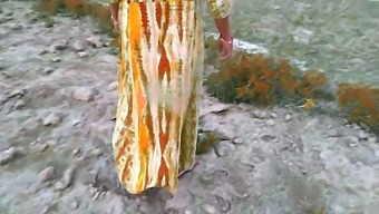 Indian Housewife And Husband Filmed Outdoors In Village